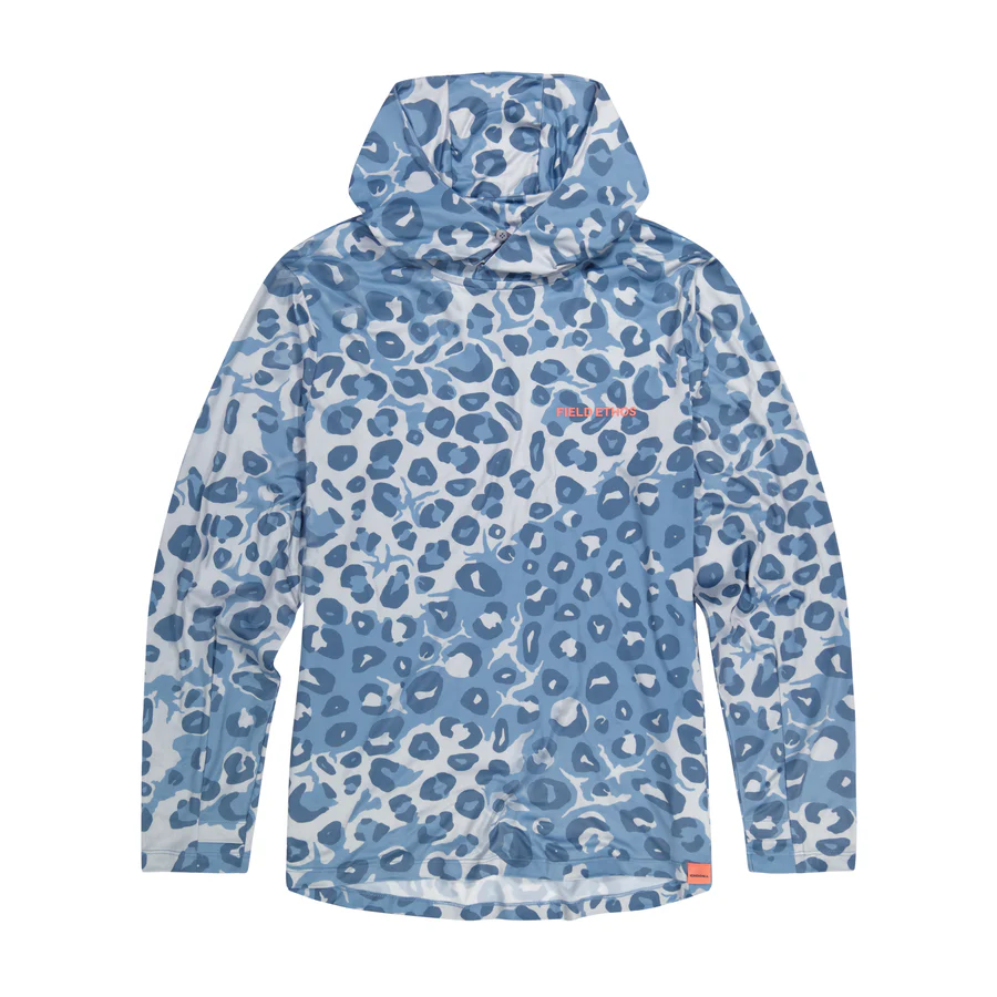 Eight shirts arranged on table in black, olive, grey, blue, white, red, mustard, and green.